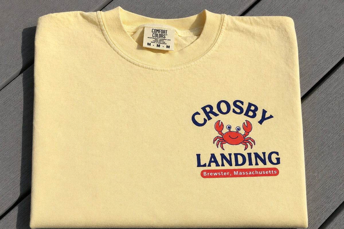 A folded T-Shirt with Crosby Landing on the Front