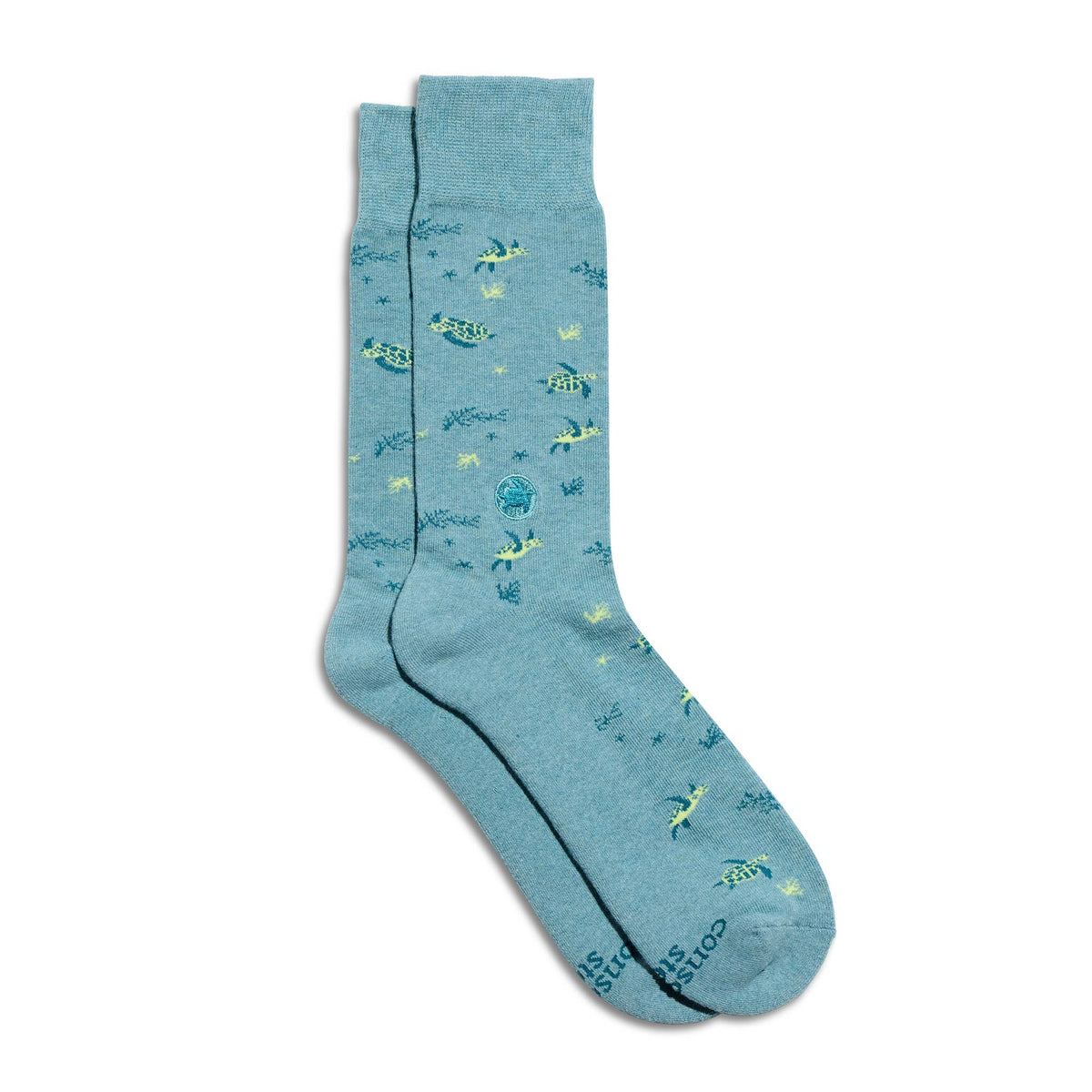Flat-lay presentation of organic cotton socks with a sea turtle knit pattern, neatly displayed on a neutral background.