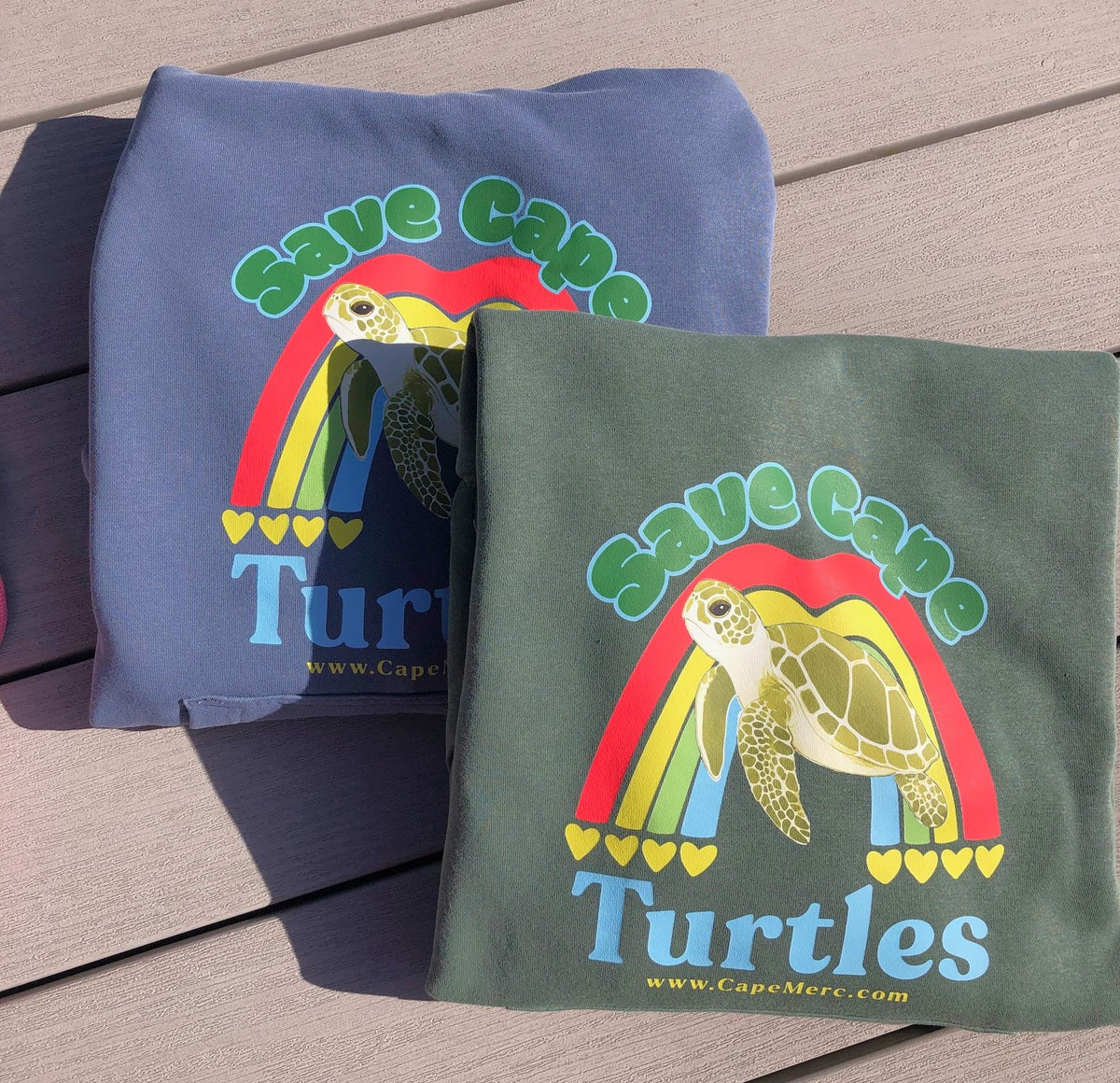 Pair of mission-driven Cape Cod sweatshirts that benefit the conservation and recovery of cold-stunned sea turtles.