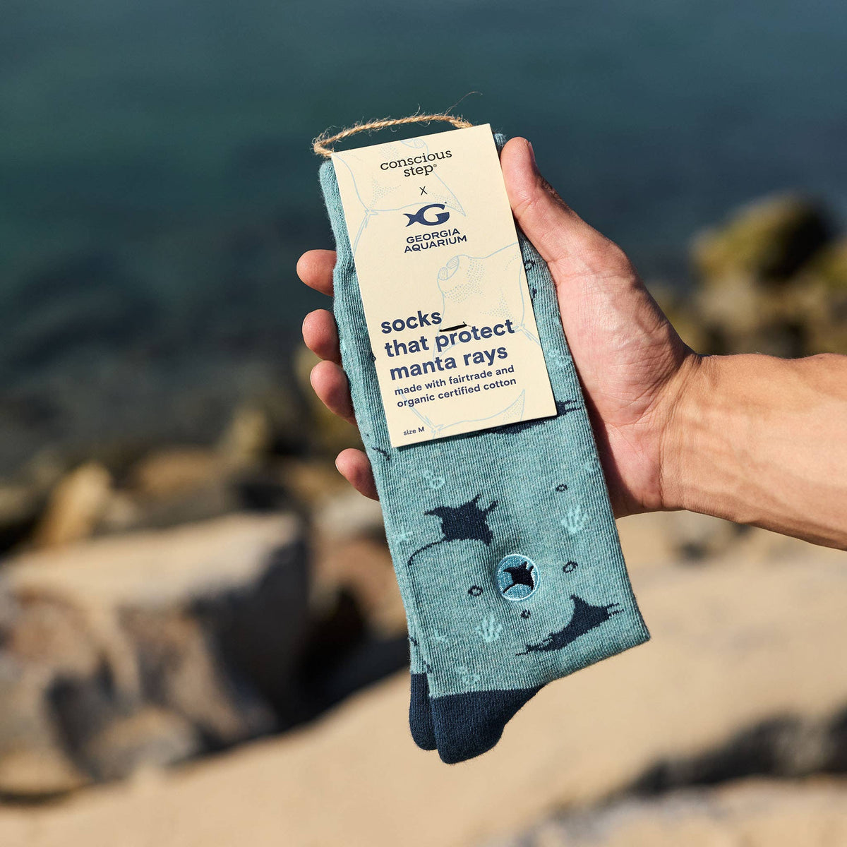 Manta Ray organic cotton protection socks that support marine conservation at the Georgia Aquarium.