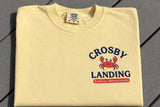 A folded T-Shirt with Crosby Landing on the Front