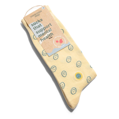 Smiley Faces organic cotton socks that support mental health in their premium eco-friendly retail package.